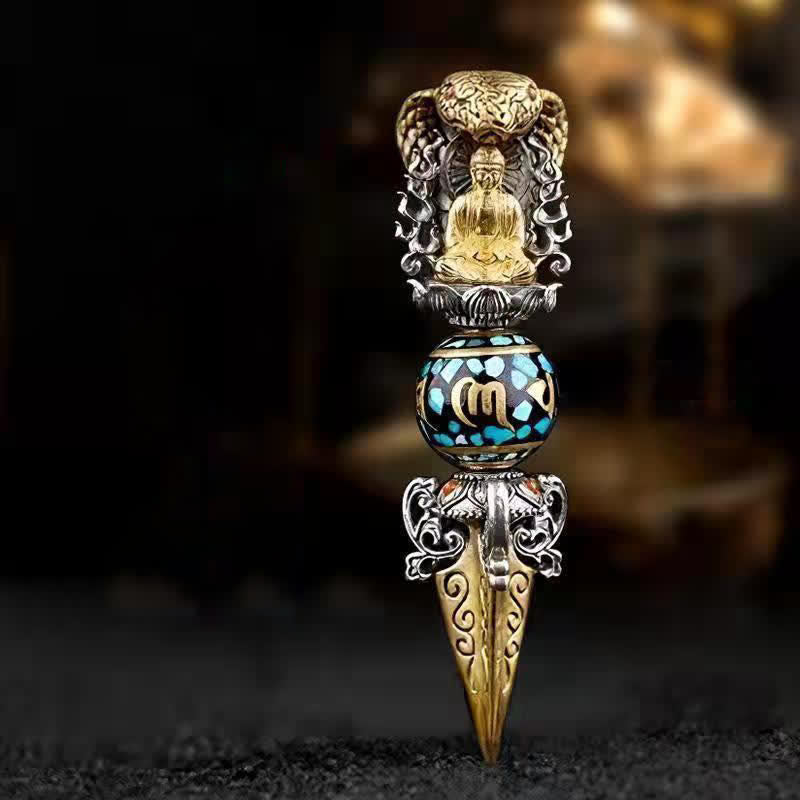 Tibetan Vajra Rotating Pendant – Gold Buddha seated in silver filigree frame with turquoise black inlaid sphere and engraved vajra blade, dark bokeh background frontal