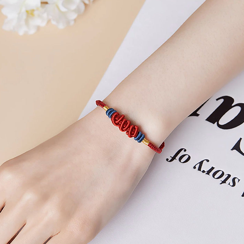 Koi Fish Jewelry – Bracelet laid flat on white background, silver braided design