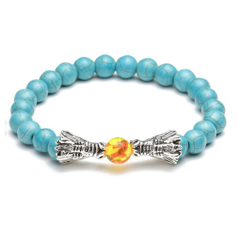 White Turquoise Lava Rock Dragon Bracelet – Turquoise beads silver feather accents amber bead front view, Peaceful
