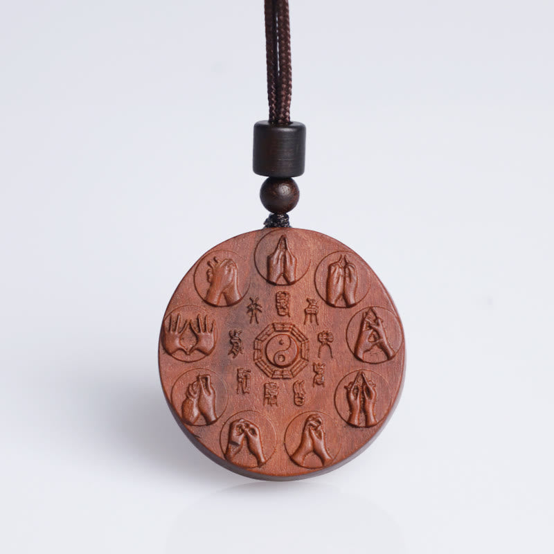 Lightning Struck Jujube Wood Pendant – Front-facing round wooden amulet with carved yin-yang bagua symbol, eight mudras and C