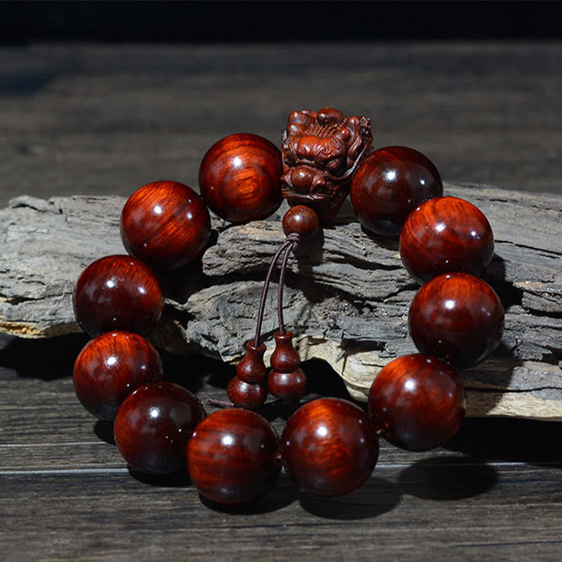 Multi-Wood Dragon Bracelet - Rosewood beads with dragon carving and gourd tassel on driftwood, Power
