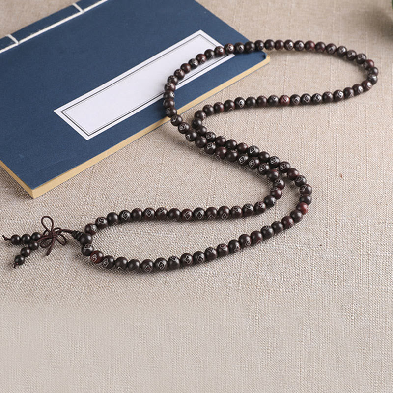Sterling Silver Sandalwood Mantra Bracelet – 108 sandalwood beads with silver inlay and blue book prop, zen beads