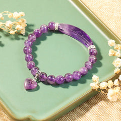 Natural Multi-Stone Love Heart Healing Bracelet - Amethyst bracelet styled on sage green ceramic surface with dried baby's breath flowers