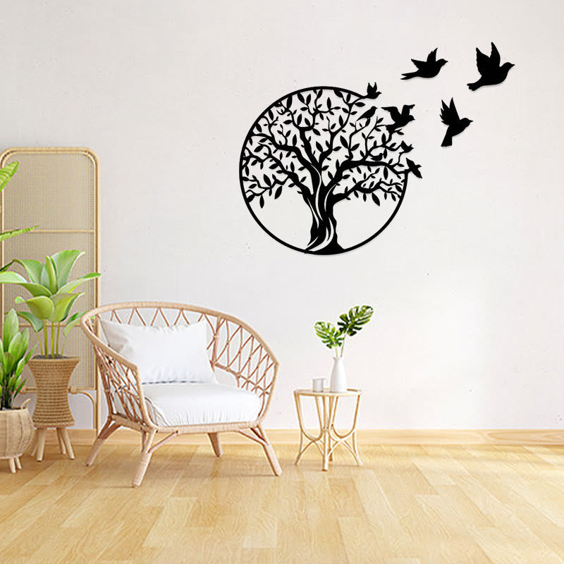 Tree of Life Birds Metal Wall Art - black tree with flying birds on white wall in boho living room with plants