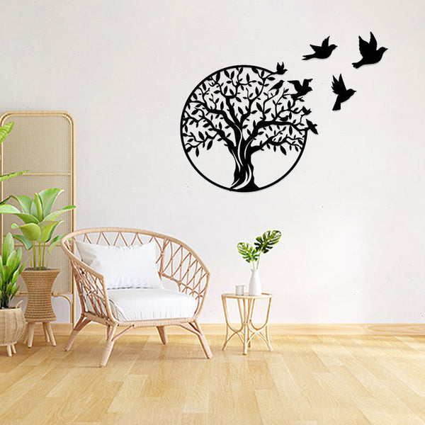Tree of Life Birds Metal Wall Art - black tree with flying birds on white wall in boho living room with plants