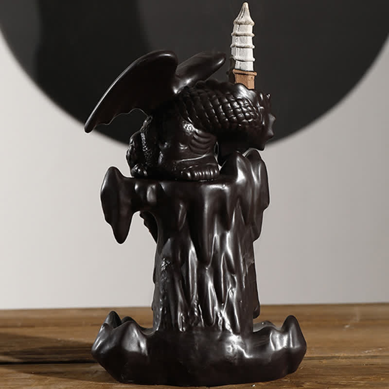 Nordic Dragon Backflow Incense Burner studio shot, winged dragon on rock formation, dark ceramic, backflow incense holder