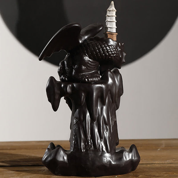 Nordic Dragon Backflow Incense Burner studio shot, winged dragon on rock formation, dark ceramic, backflow incense holder