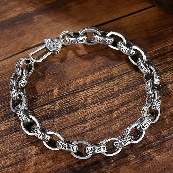 Silver Om Mani Padme Hum Bangle – Relaxed loop on walnut, oxidized silver bracelet