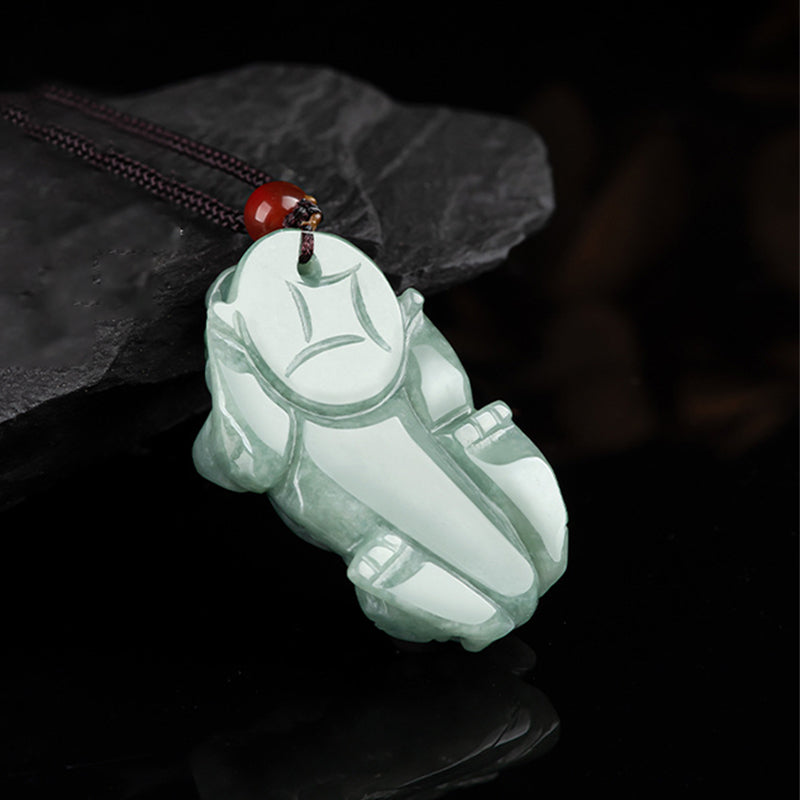Jade PiXiu Necklace – Back view pale green jade Pixiu showing smooth carved surface, dark background