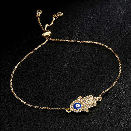 Hamsa Hand Evil Eye Bolo Bracelet Gold Chain with Blue Eye Detail on Black Leather