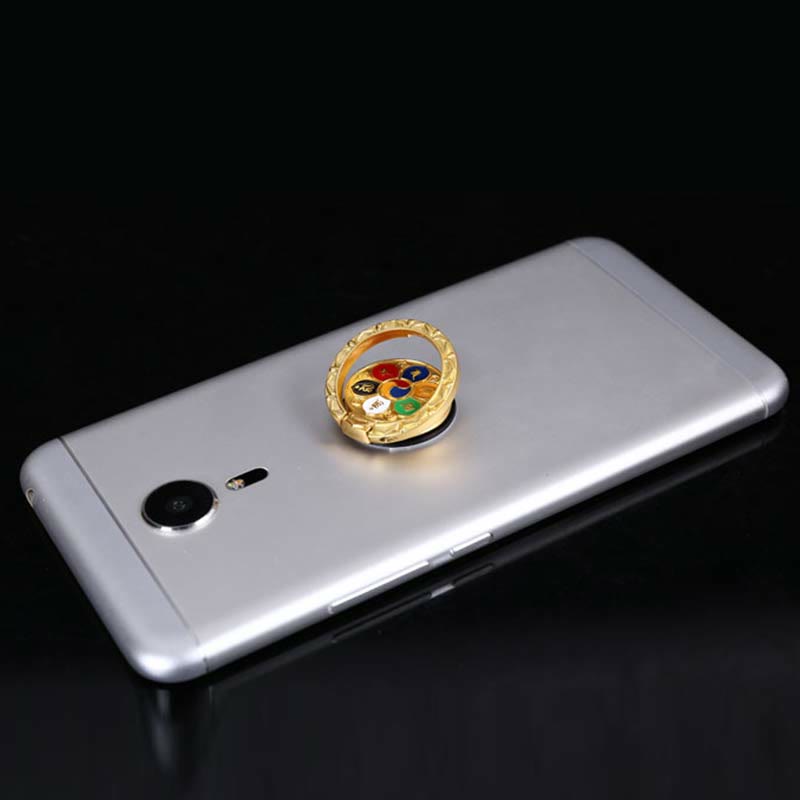 Om Mani Padme Hum Phone Ring Holder – Gold ring with multicolor enamel on silver phone, spiritual accessory