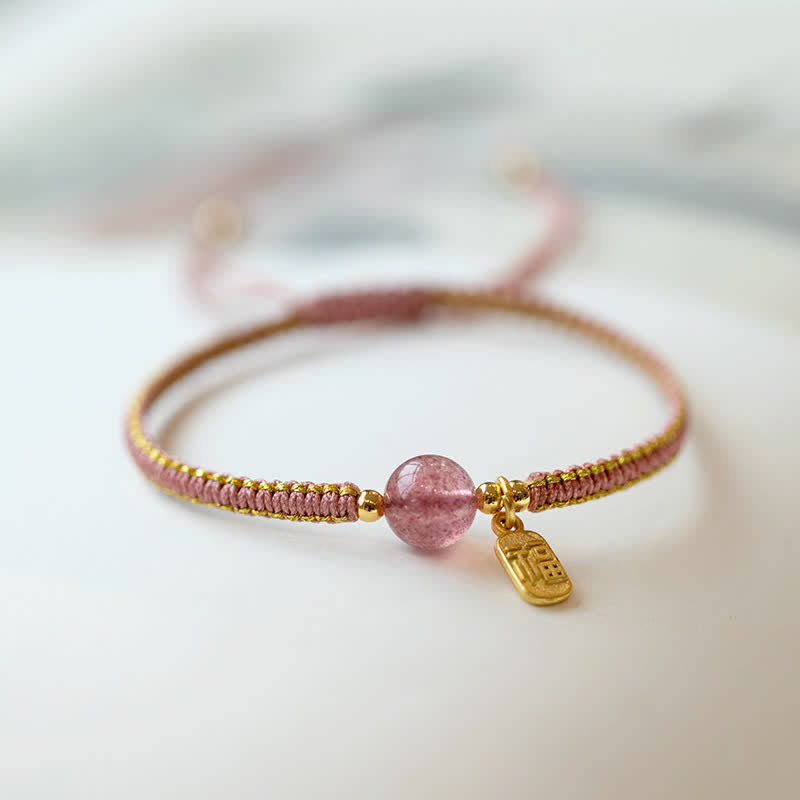 Red Agate Jade Lotus Bracelet – pink gold cord with strawberry quartz bead and Fu fortune charm, wrist lifestyle photo