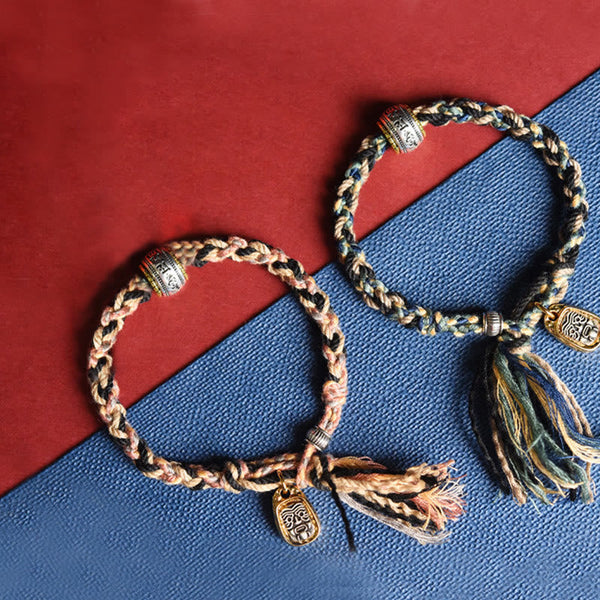 Zakiram Goddess Bracelet – Paired braided bracelets in peach and blue tones with tassel ends, ethnic jewelry set