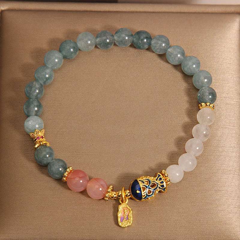 Jade Agate Koi Scripture Bracelet – natural light shot highlighting agate banding and jade glow