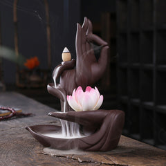 Tibetan Lotus Incense Burner – Buddha hand mudra with cascading smoke on dark wood, zen decor