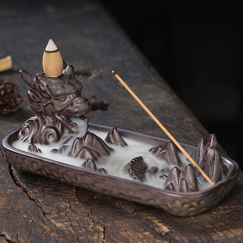 Dragon Incense Burner - smoke cascading from mouth over mountains, dark wood, zen