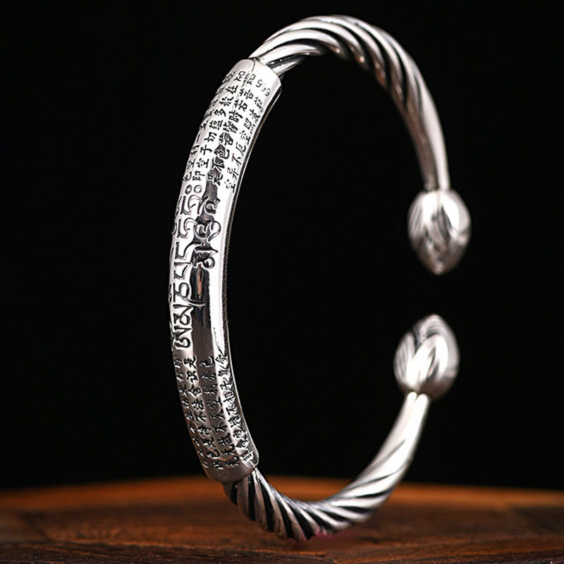 Tibetan Heart Sutra Cuff Bracelet – angled side view on dark background, Heart Sutra calligraphy and Om mantra