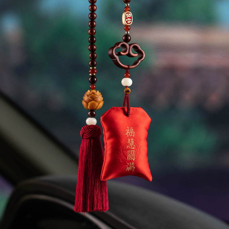 Red Sandalwood Car Hanging – Rearview mirror context with blessing pouch and lotus tassel hanging on sandalwood bead strands