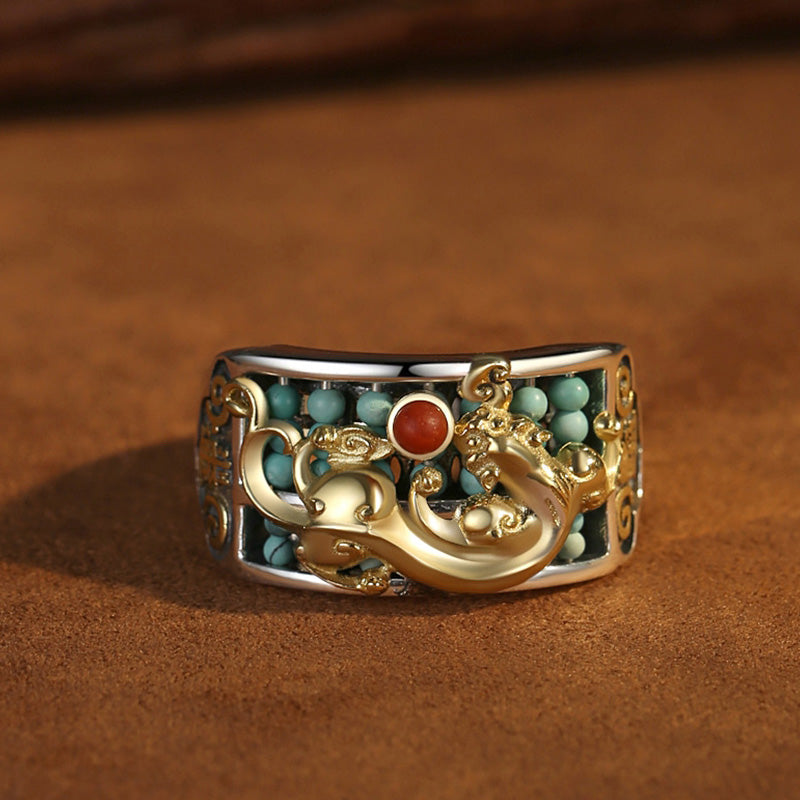 Silver PiXiu Ring – Front view gold PiXiu on silver band with turquoise inlay, warm brown background