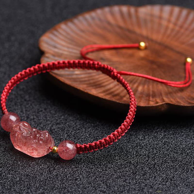 Strawberry Quartz PiXiu Red Bracelet – dark surface wooden leaf dish, red braided cord, love luck bracelet
