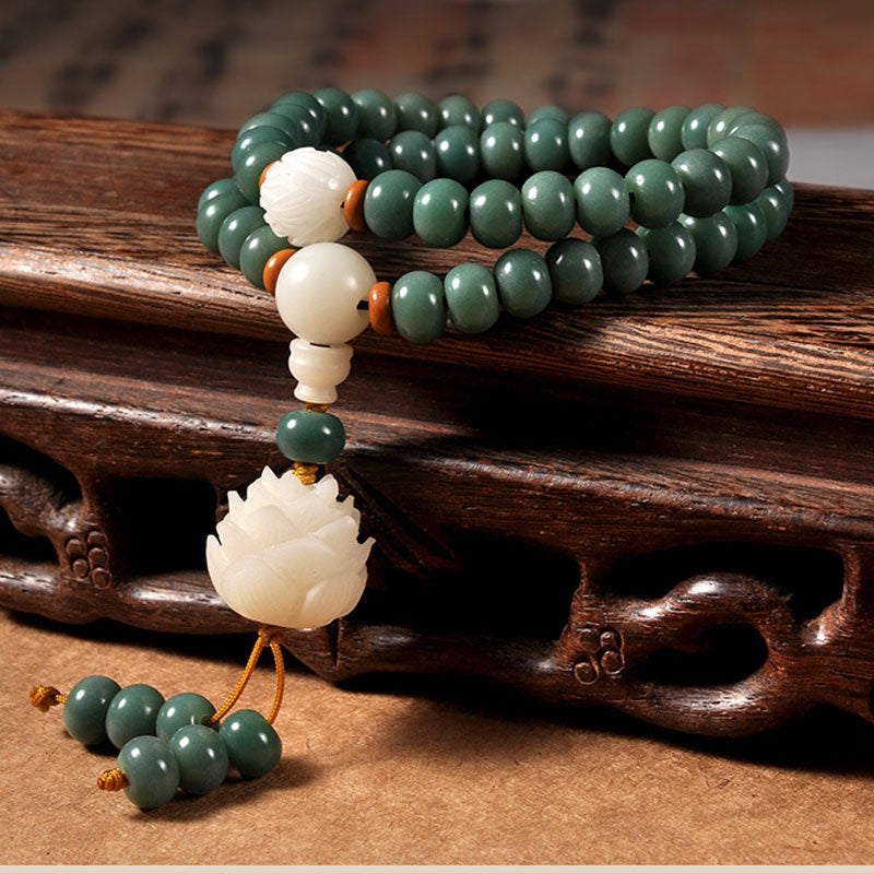 Bodhi Seed Lotus Bracelet – carved lotus pendant on wooden stand, bodhi seed wisdom