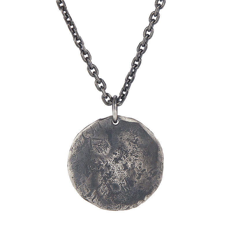 Sterling Silver Yin Yang Necklace – Full view of textured disc pendant on thick curb chain, white background