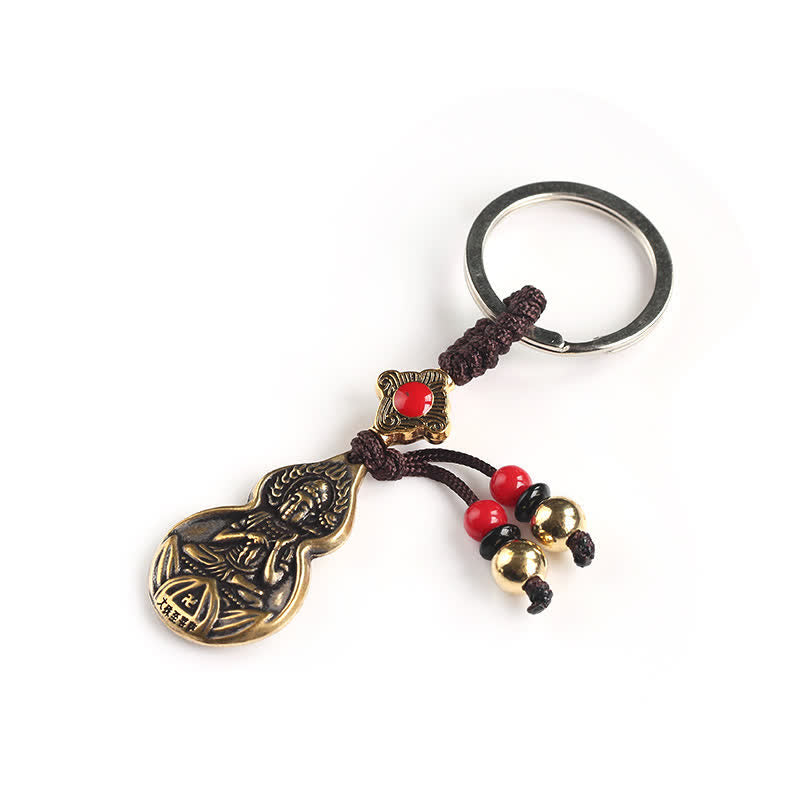 Blessing Buddha Keychain – warm copper tone miniature statue, daily Buddhist reminder charm