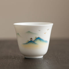 Ceramic Kung Fu Tea Cup – blue-green mountain landscape with pavilion and birds in flight, shanshui style, serene