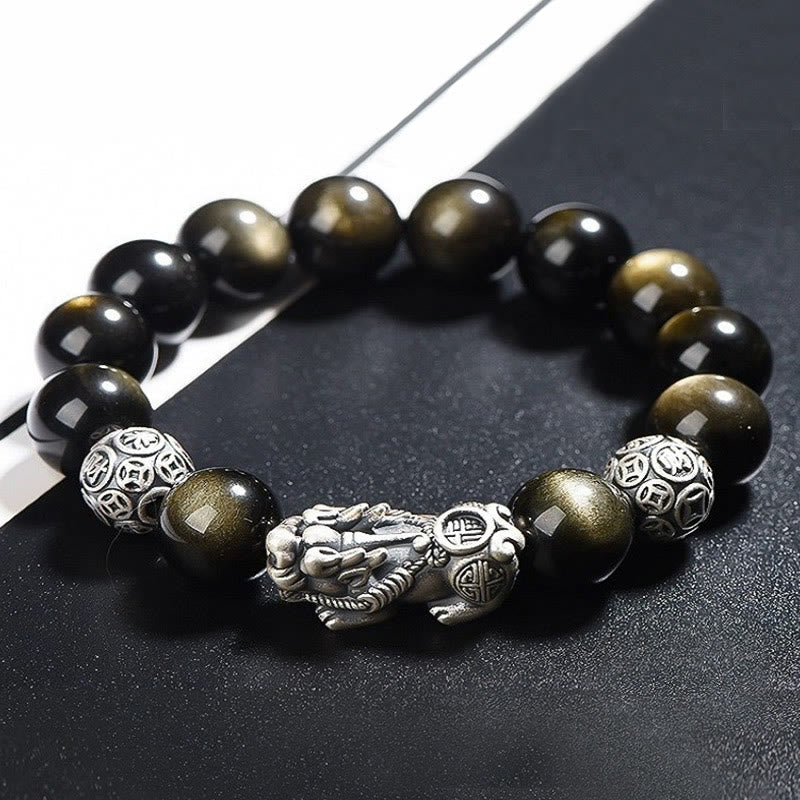 Gold Sheen Obsidian PiXiu Bracelet – Close-up side view of PiXiu charm between gold-sheen beads on black