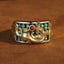 Silver PiXiu Ring – 925 silver band with gold PiXiu, turquoise beads, red agate center, brown suede background