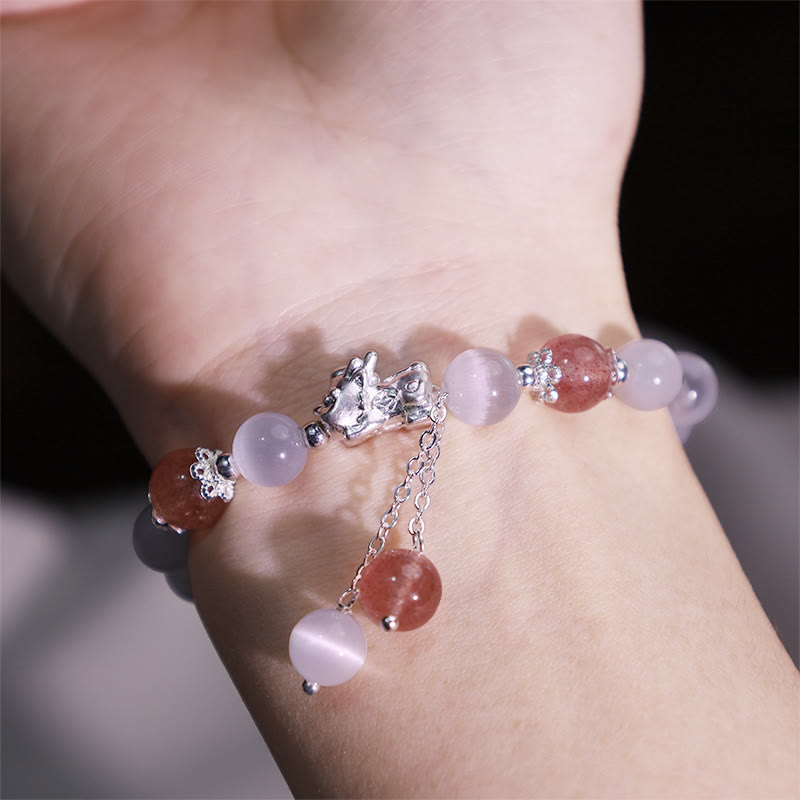 Cat's Eye PiXiu Bracelet – Close-up wrist shot with strawberry quartz beads and silver charm detail