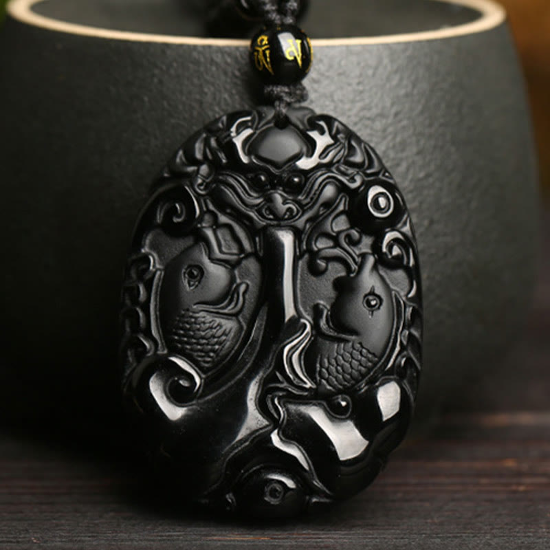Black Obsidian Koi Fish Bead Rope Necklace – close-up of koi fish pendant carving, glossy obsidian stone