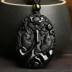 Black Obsidian Koi Fish Bead Rope Necklace – close-up of koi fish pendant carving, glossy obsidian stone