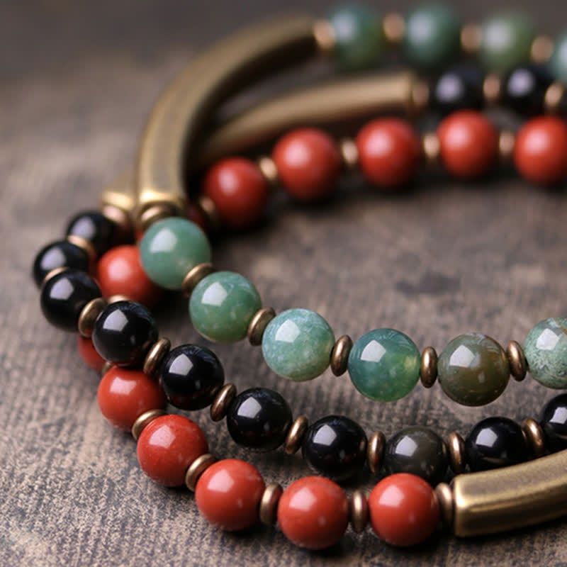 Triple-strand couple bracelet featuring red jasper, moss agate green and black obsidian beads with two antique brass curved bar connectors, multi-color boho jewelry