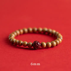 Peach Wood & Cinnabar Lotus Bracelet single strand 6mm, carved red lotus focal bead on crimson, mindful bead bracelet