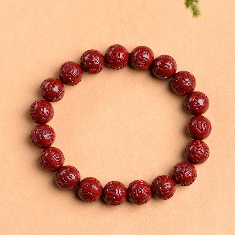 Cinnabar Om Mani Padme Hum Bracelet – mantra carved burgundy beads with pine accent, red mala bracelet