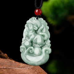 Green Jade Zodiac Necklace - Rat carving on black cord with nature bokeh, zodiac protection