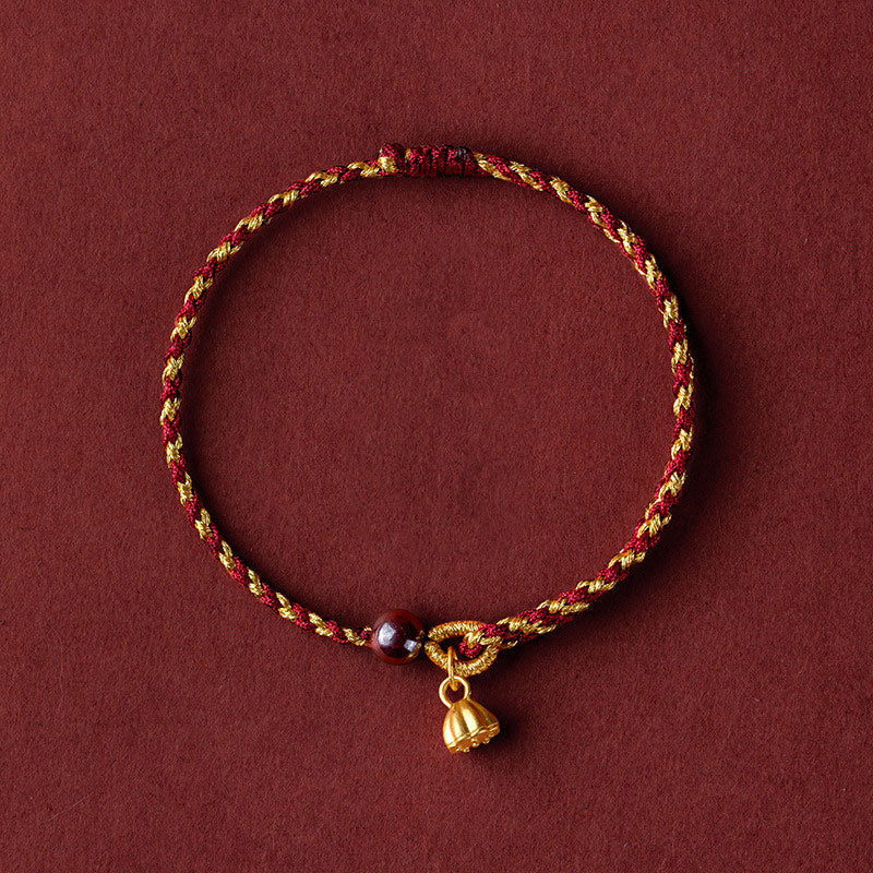 Red Gold Rope Lotus Braid Bracelet - circular flat lay with lotus pod charm, lucky cord bracelet