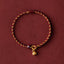 Red Gold Rope Lotus Braid Bracelet - circular flat lay with lotus pod charm, lucky cord bracelet