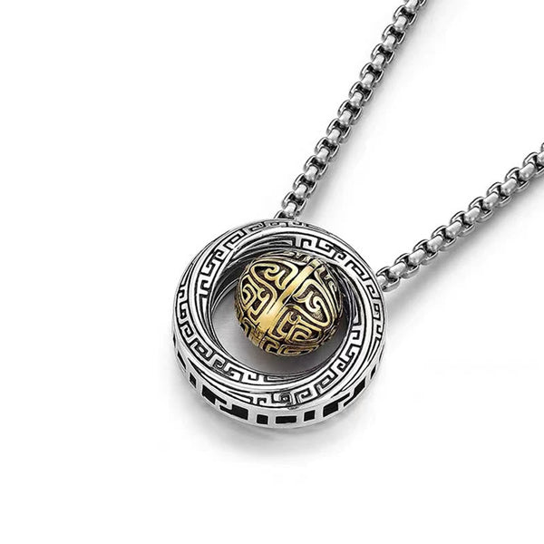 Mobius pendant necklace with interlocking loops and patterned center sphere, angled view