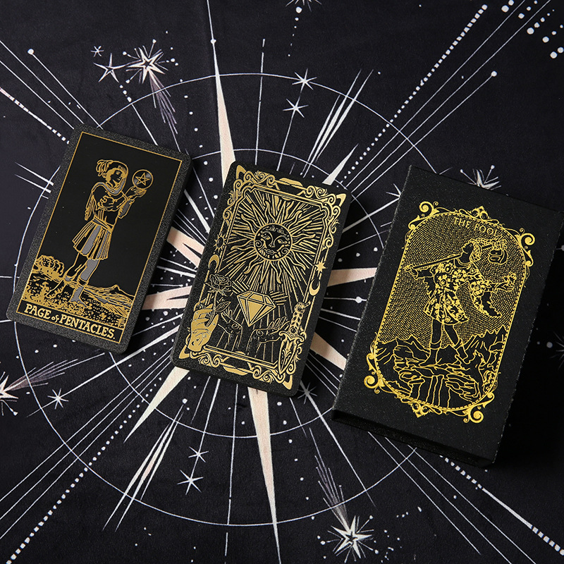Waterproof Tarot Deck – Gold metallic card back with sunburst and moon phases on celestial cloth
