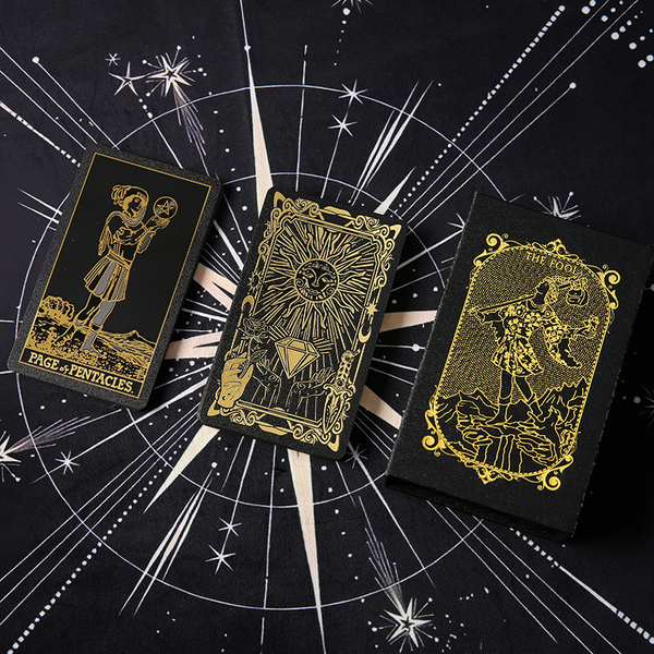Waterproof Tarot Deck – Gold metallic card back with sunburst and moon phases on celestial cloth