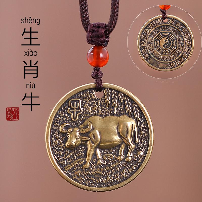 Zodiac Bagua Pendant – brass ox coin with Chinese seal, textured antique bronze finish, protection