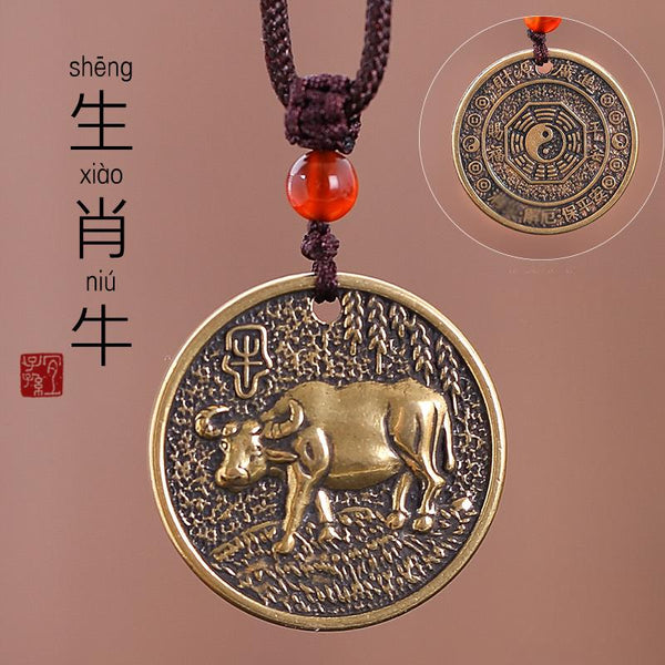 Zodiac Bagua Pendant – brass ox coin with Chinese seal, textured antique bronze finish, protection
