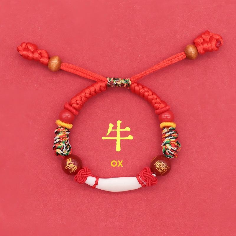 Kids Zodiac Bracelet – ox zodiac version, red knotwork, white canine tooth center, sleep protection