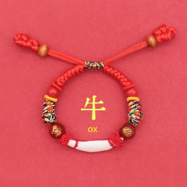 Kids Zodiac Bracelet – ox zodiac version, red knotwork, white canine tooth center, sleep protection