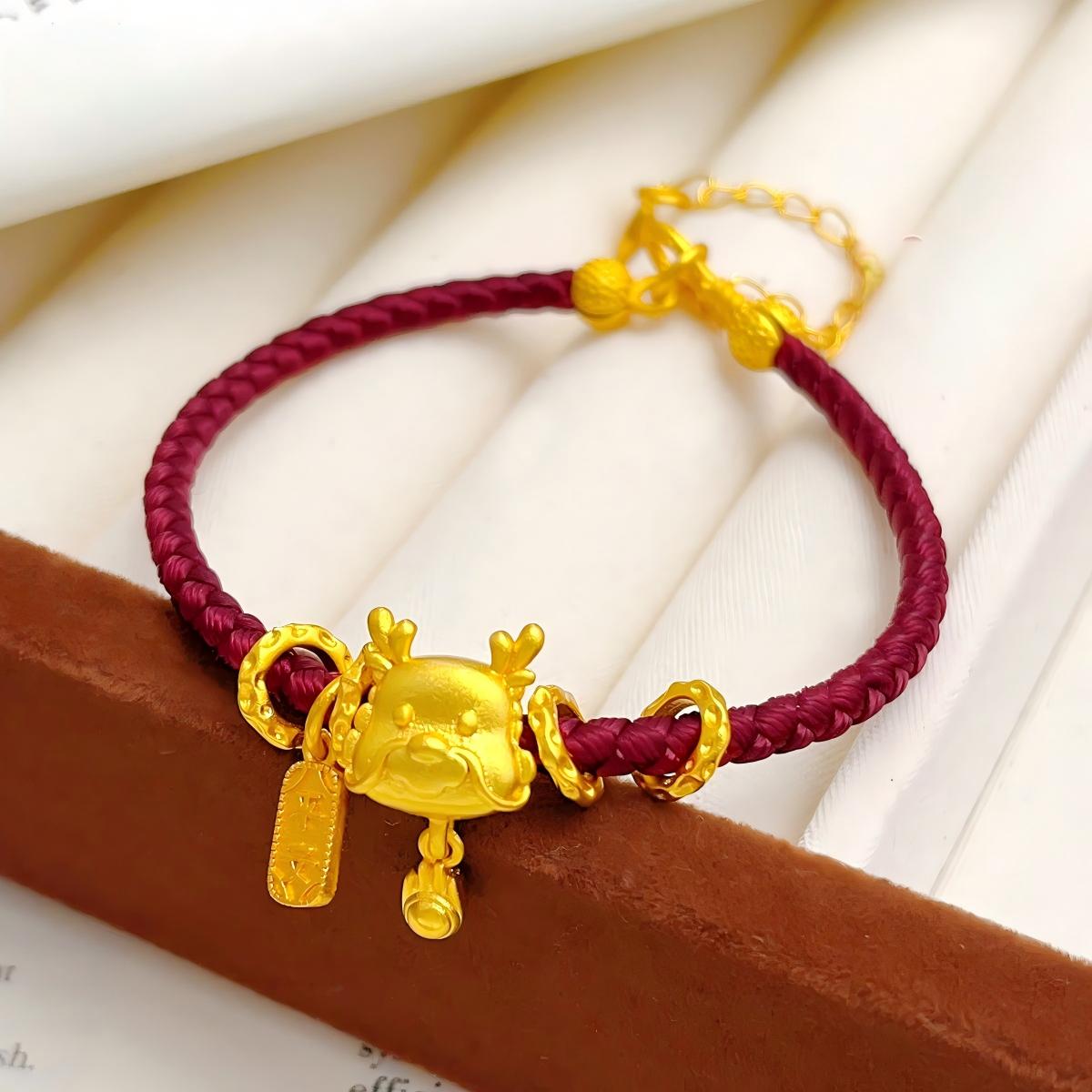 Ben Ming Nian Bracelet – gold deer-horn charm on wine-red cord, textured rings, Chinese new year
