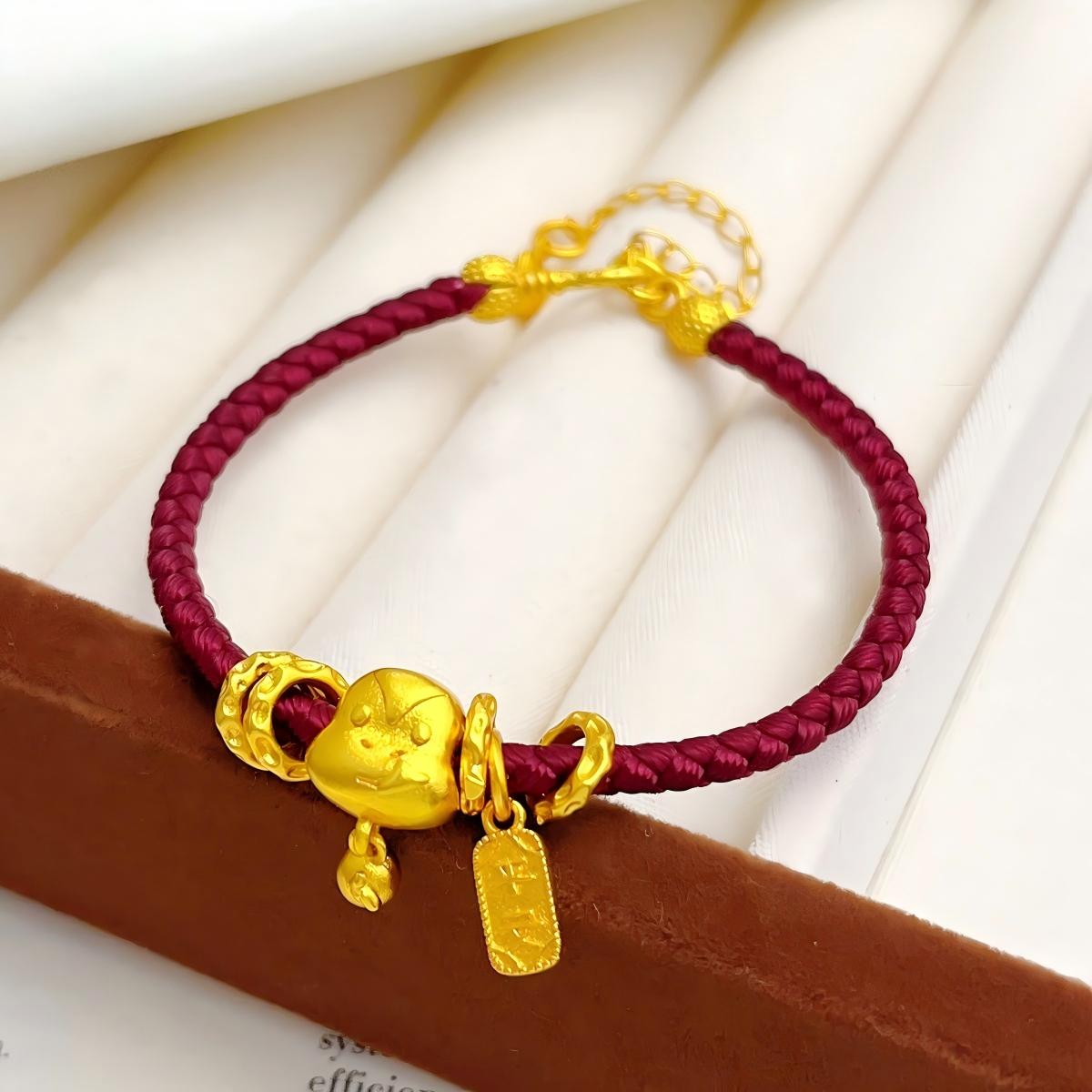 Ben Ming Nian Bracelet – gold horse charm with curved pendant, rich red braided rope, prosperity