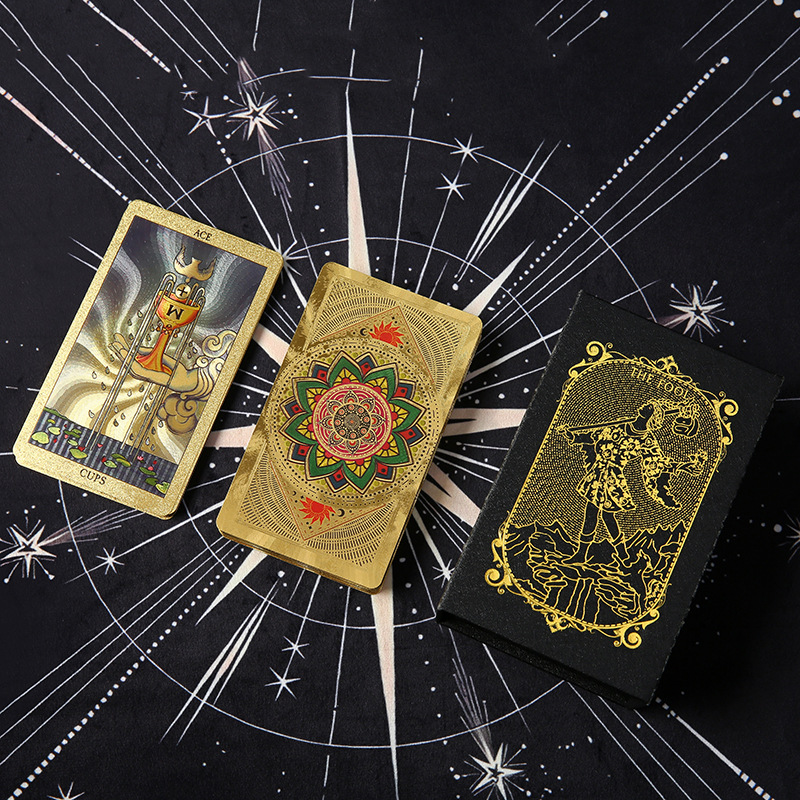 Waterproof Tarot Deck – Multiple gold foil cards displayed on black celestial backdrop, luxury deck