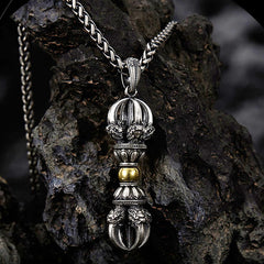 Tibetan Vajra Dorje Pendant Necklace – Oxidized silver with gold lotus accents and ornate filigree, dark volcanic rock backdrop